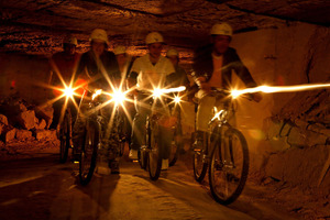 Cyclists don mining helmets to tackle the tunnels at Valkenburg. Photo / Supplied