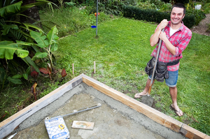 Sleeper edging on a patio acts as a container for the base course and pavers, as well as a step from the lawn. Photo / Natalie Slade