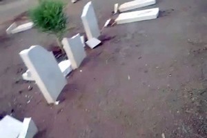 An image grab taken from YouTube on March 3, 2012 perportedly shows broken headstones at the Benghazi War Cemetery and the Benghazi British Military Cemetery. Photo / AFP