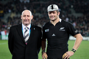 All Black captain Richie McCaw receives his 100th test cap from Jock Hobbs during the Rugby World Cup. Photo / Sarah Ivey