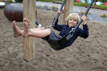 Lucien Perez, 7, is helping his body and brain to develop as he enjoys some unstructured play time on the swing at Wynyard Quarter in Auckland.  Photo / Sarah Ivey