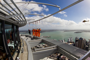 Volvo race crews participate in a Sky Walk on the Sky Tower. Photo / Ian Roman