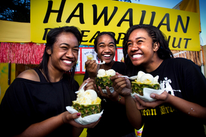 From left, Joanna Lee-Lo, Joella Lee-Lo and Tia Toiu enjoy their real deal pineapple and icecream. Photo / Natalie Slade