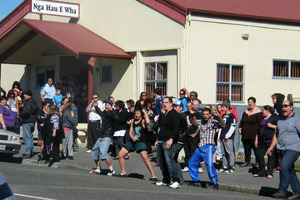 A haka was directed at the media outside the marae. Photo / Vaughan Elder