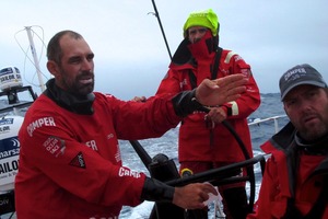 Stu Bannatyne points out the position of an opposition boat onboard Camper. Photo / Hamish Hooper/CAMPER ETNZ/Volvo Ocean Race