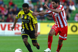 Paul Ifill of the Phoenix is chased Wayne Srhoj of the Heart during the round 23 A-League match between the Melbourne Heart and the Wellington Phoenix at AAMI Park. Photo / Getty Images