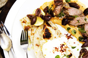 African spiced hummus with lamb and olives. Photo / Babiche Martens