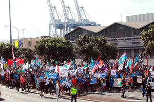 Protesters march as part of Ports of Auckland industrial action earlier this month. Photo / Doug Sherring