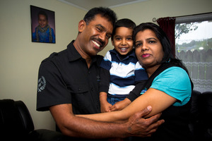 3-year-old Hamish Pranav Gosai with his dad Mukesh Kumar and mother Anjini Kumar at their home in Manukau, Wednesday. Photo / Dean Purcell