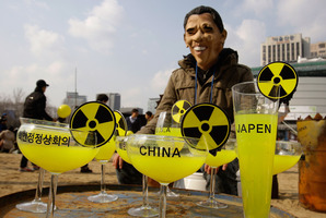 A South Korean, Obama-masked activist protests about nuclear power plants. Photo / AP