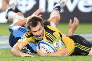 Hurricanes captain Conrad Smith scores the winning try against the Blues. Photo / Greg Bowker