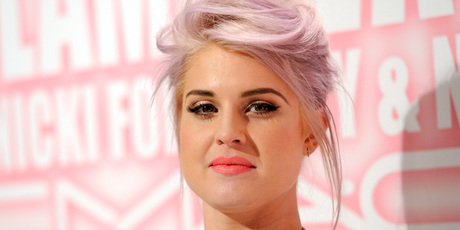 Kelly Osbourne says she was 'body slammed' by paparazzi but was even more cross when he proceeded to question her about her brother's dead dog. Photo / AP Kelly Osbourne says she was 'body slammed' by paparazzi but was even more cross when he proceeded to question her about her brother's dead dog. Photo / AP