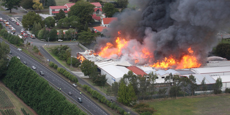 Flames engulf the Icepak Coolstores plant at Tamahere. Photo / APN