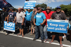 Members of the Maritime Union and Auckland port workers protest on Tamaki Drive. Photo / Sarah Ivey