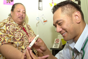 Mata Vaipo is tested for diabetes by student nurse Kora Collin in Rotorua. Photo / APN