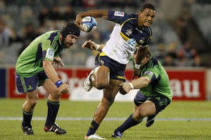 Henry Speight of the Brumbies fends off a tackle during the round five Super Rugby match between the Brumbies and the Highlanders. Photo / Getty Images.