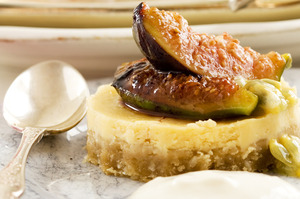 Lemon cheesecake with passionfruit and grilled figs. Photo / Babiche Martens