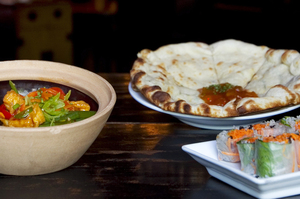Monsoon Poon’s Sichuan claypot with Vietnamese spring rolls and aloo naan. Photo / Natalie Slade