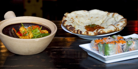 Monsoon Poon’s Sichuan claypot with Vietnamese spring rolls and aloo naan. Photo / Natalie Slade