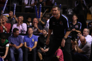 Breakers coach Andrej Lemanis yells at the team from courtside while fans cheer them on with thundersticks. Photo / Getty Images