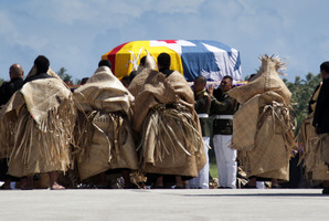 The body of King George Tupou V is taken from the plane after arriving in Tonga on a flight from Hong Kong. Photo / Sarah Ivey