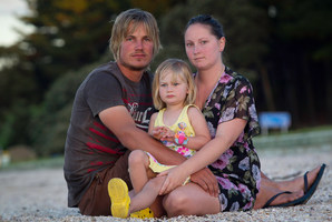 Sara Smith with husband Lance and 2-year-old Holly. Mrs Smith lost another daughter at birth in Middlemore Hospital, and says she now has to seek a surrogate mother to have more children. Photo / Richard Robinson