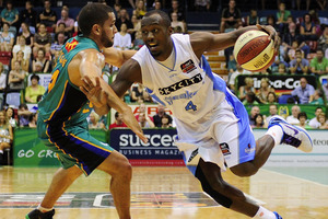 Cedric Jackson of the Breakers drives past Michael Cedar of the Crocodiles. Photo / Getty Images