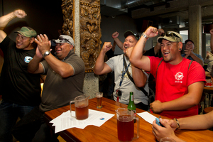 Unionists at the Auckland Maritime Club greet the news that the Ports of Auckland lockout is over. Photo / Brett Phibbs