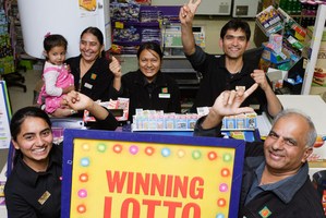 Te Kauwhata Four Square owner Jesal Patel (bottom right), with family. Photo / Stephen Barker