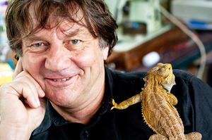 Architect and cartoonist Malcolm Walker with Sid the Mexican Bearded Lizard. Photo / Babiche Martens