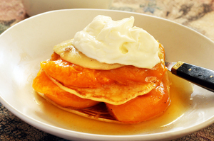 Top poached fruit pancakes with cream or mascarpone. Photo / Janna Dixon
