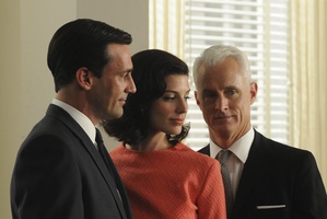 Don Draper's surprising relationship with his secretary, played by Jessica Pare (centre) has upped the competition level between him and Roger Sterling. Photo / Supplied