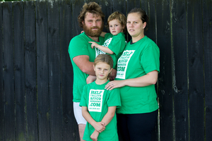 Locked-out Horotiu meat worker Drew Fletcher with his partner Mere Tiana and their children Charnt and Demetri. Photo / Dean Purcell