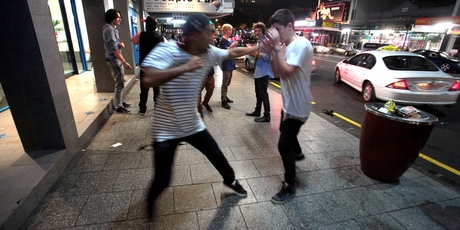 Friends playfight while taking a break from clubbing during Easter weekend on Karangahape Rd. Photo / Bradley Ambrose