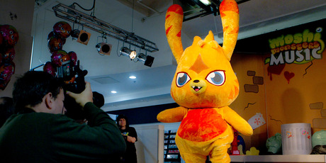The release of the Moshi Monster's debut album, complete with the store-front performances, brought crowds of children and attendant adults. Photo / AP