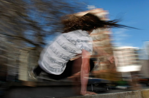 A parkour enthusiast leaps over wall at Aotea Square in central Auckland. Photo / Kenny Rodger
