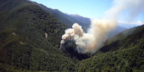 Smoke billows from the ventilation shaft after the fourth explosion in the Pike River coal mine. Photo / NZPA