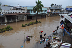 Shop owners clean up whatever is left in Nadi town. Photo / supplied