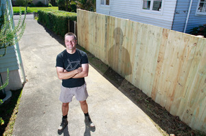 Justin Newcombe insists that a fence can actually bring neighbours together. Photo / Steven McNicholl