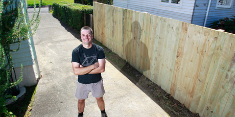 Justin Newcombe insists that a fence can actually bring neighbours together. Photo / Steven McNicholl