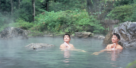 Steam rises from an onsen. Photo / Japanese Tourist Organisation