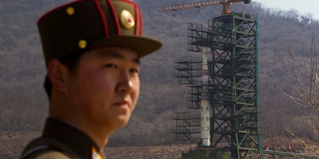 2012 file photo, a North Korean soldier stands in front of the country's Unha-3 rocket, slated for liftoff between April 12-16, at a launching site in Tongchang-ri. Photo / AP