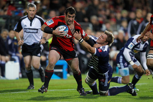 Cory Flynn of the Crusaders is tackled during the match against the Stormers. Photo / Getty Images