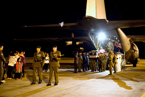 Senior military officials pay tribute to CPL Hughes as he is carried off a RNZAF C-130 aircraft. Photo / Supplied
