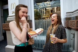 Kate Fitzgibbon, 16, from Grey Lynn (left) and Mily Hemi, 17, from Manurewa look forward to their fast-food meals. Photo / Dean Purcell