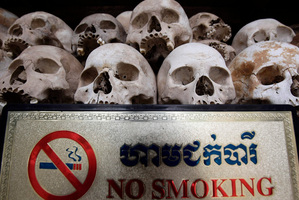 Human sculls are displayed in the stupa of Choeung Ek, a former Khmer Rouge 'killing field' dotted with mass graves about nine miles (15 km) south of Phnom Penh, Cambodia. Photo / AP