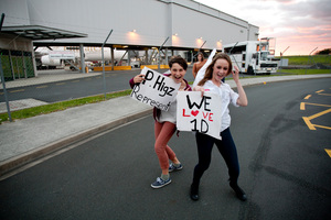 One Direction fans run around Auckland International Airport hopeful for the chance to see One Direction as they fly in from Australia. Photo / Dean Purcell