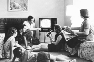 A family watching television in the lounge of their home. 1962 file photo / New Zealand Herald
