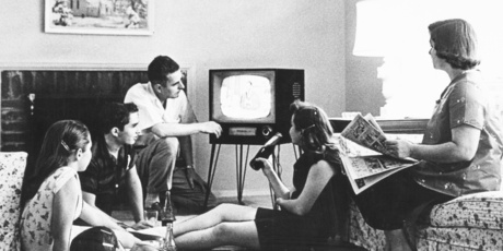 A family watching television in the lounge of their home. 1962 file photo / New Zealand Herald