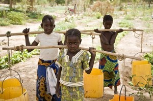 Halimatou Issaka, 10, Safoura Souley, 9, and Rachida Adamou, help out in the garden after school in near Banibangou, Niger. Photo / AFP